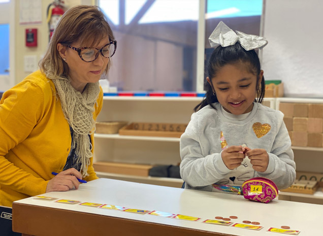 Montessori School of Tracy teacher working with daycare child